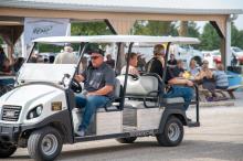 Members on golf cart